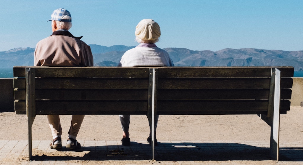 seniors on a bench, assisted living vs memory care