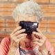 assisted living community, elderly woman taking a picture